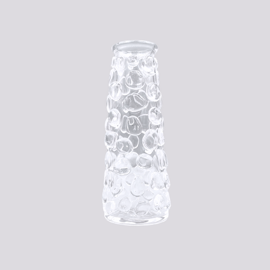 a clear glass vessel with bubbles.