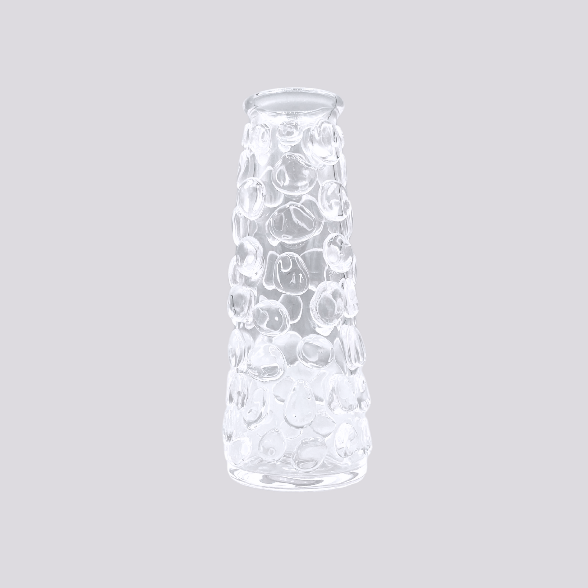 a clear glass vessel with bubbles.